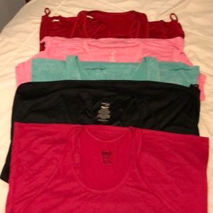 Five work out tops lightly worn if at all.